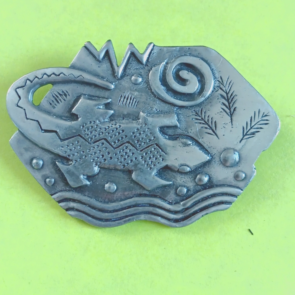 Artistic Silver Brooch with Geometric Patterns